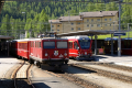 Pontresina. Ge 4/4 I 601 vor Reginalzug nach Scuol und ABe 8/12 3501 vor RE nach St. Moritz.